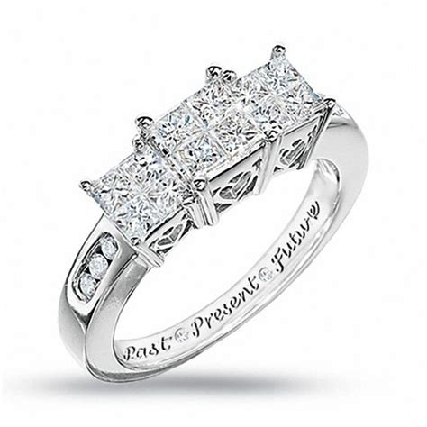 The graceful diamond-lined shank completes the design. . Zales past present future ring